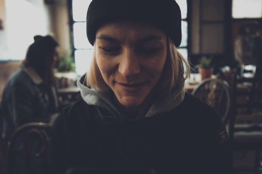 man smiling in cafe