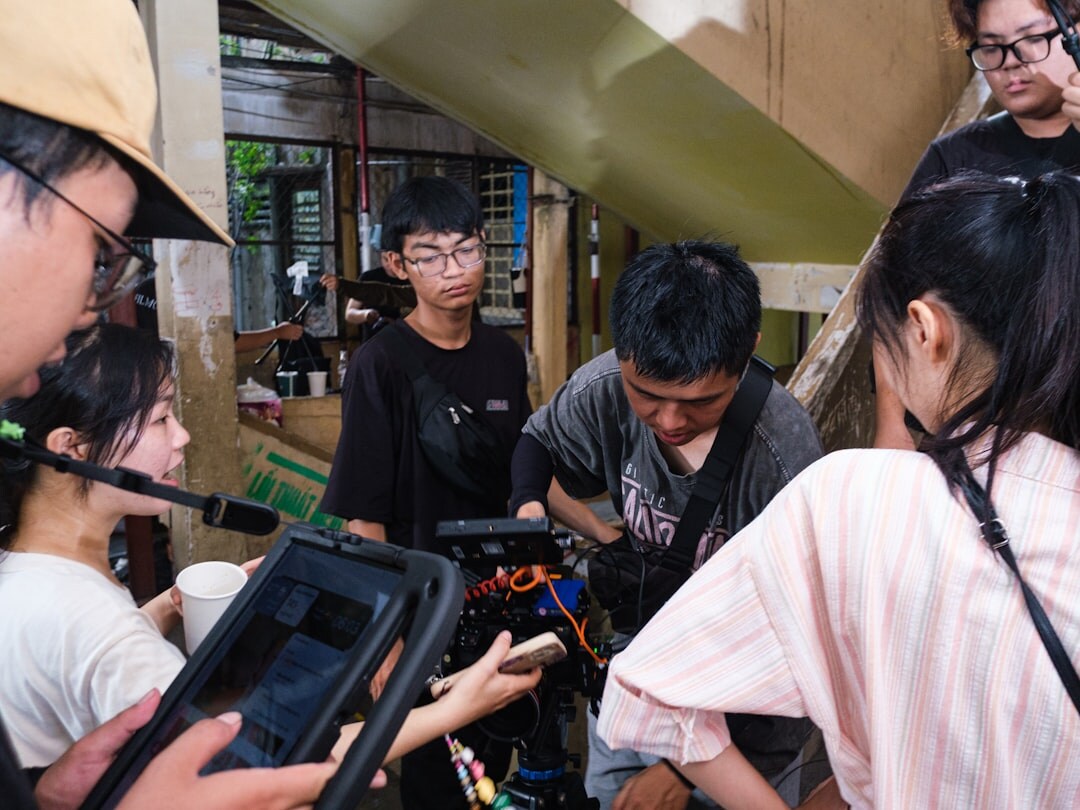 Editorial team of journalists working in a modern bright newsroom