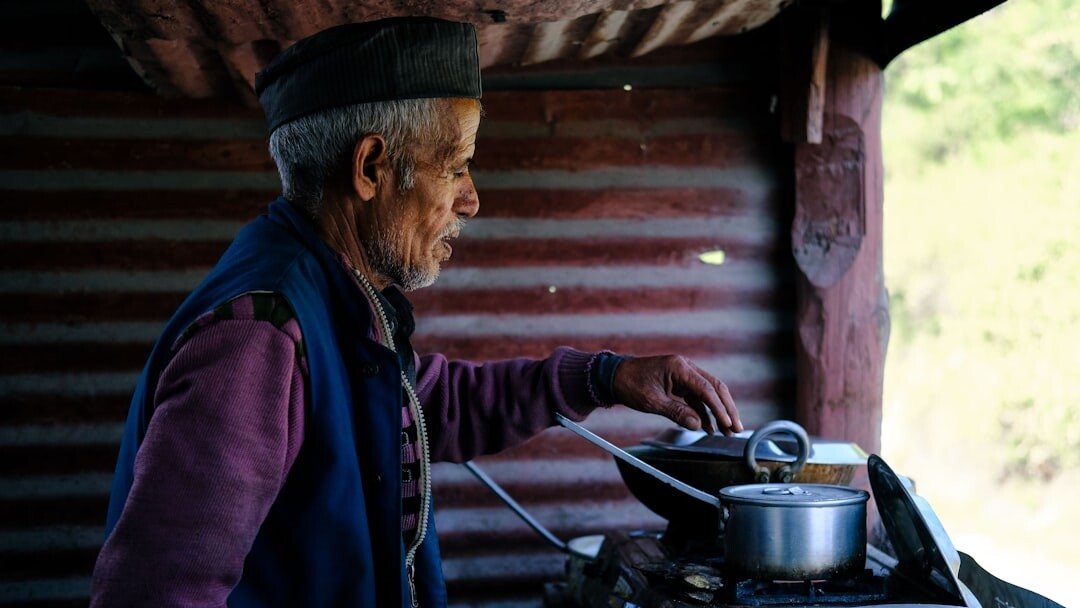 older man serving coffee
