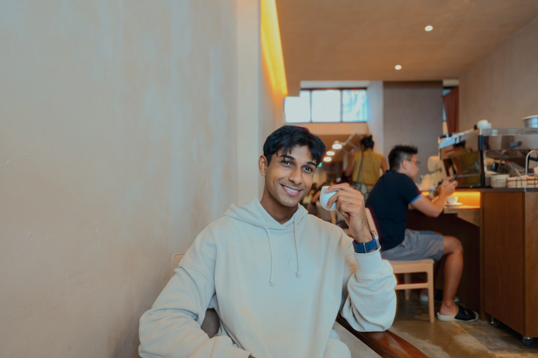 man smiling in cafe